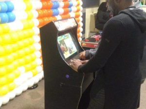 gamer playing retro arcade game