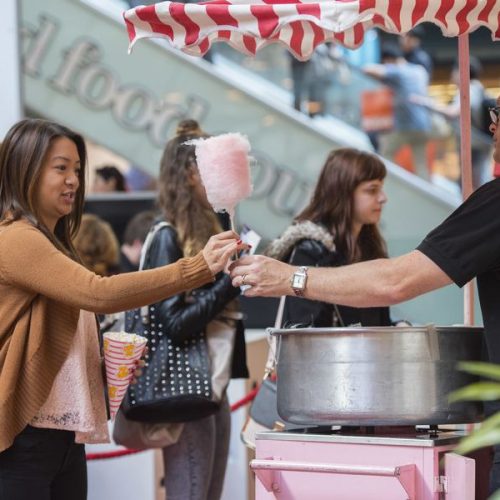 Crew member serving candyfloss LK Crew member serving candyfloss LK