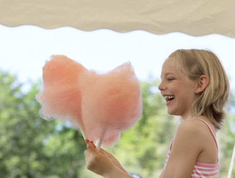 Girl eating Candy Floss at Natasha’s Wedding Girl eating Candy Floss at Natasha's Wedding