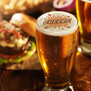 beer and burgers on wooden table beer and burgers on wooden table